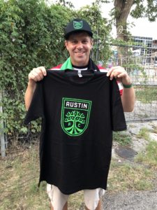 Shawn Collins showing an Austin FC shirt
