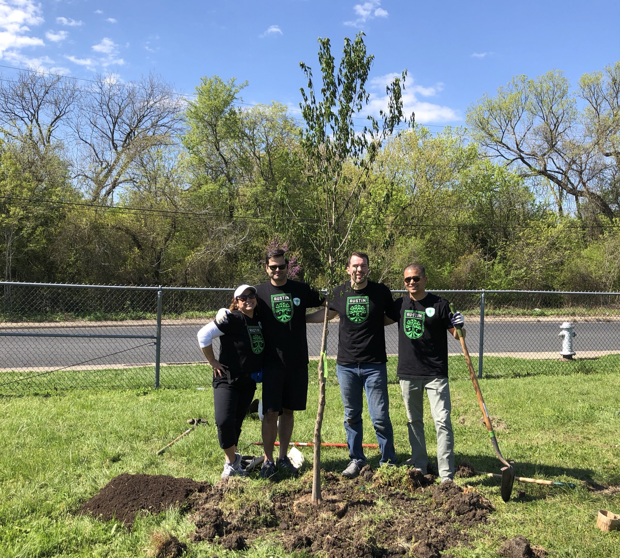 Austin FC staff planting trees